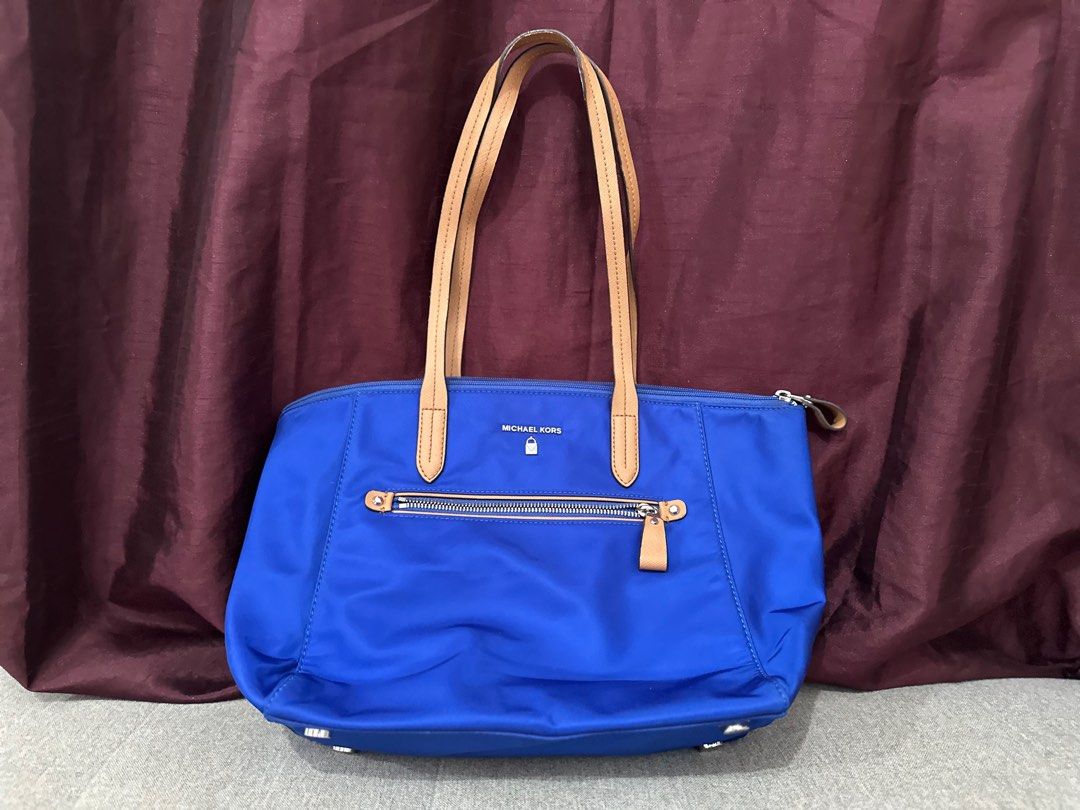MK Tote Bag (Category: Luxury Bags & Wallets) located in Cagayan de Oro. Submitted by eloisag (Listing ID 1324923549, Image 1). Description: Very nice nylon MK tote bag. With signs of usage on the straps but still very good for daily or office use. PM me for more pictures or check my initial listing. RFS: decluttering.