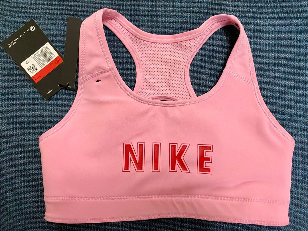 NIKE Reversible Sports Bra (Category: Activewear) located in Quezon City. Submitted by biancaadj (Listing ID 1324790223, Image 3). Description: Nike Reversible Sports Bra -Original -Brand New w/ tag -Reversible -Large on tag (usually for 12-13yo girls but can fit petite women 75 cm) -Kindly see tag on photos for additional info on sizing -No pads RFS: Decluttering, never been used.
