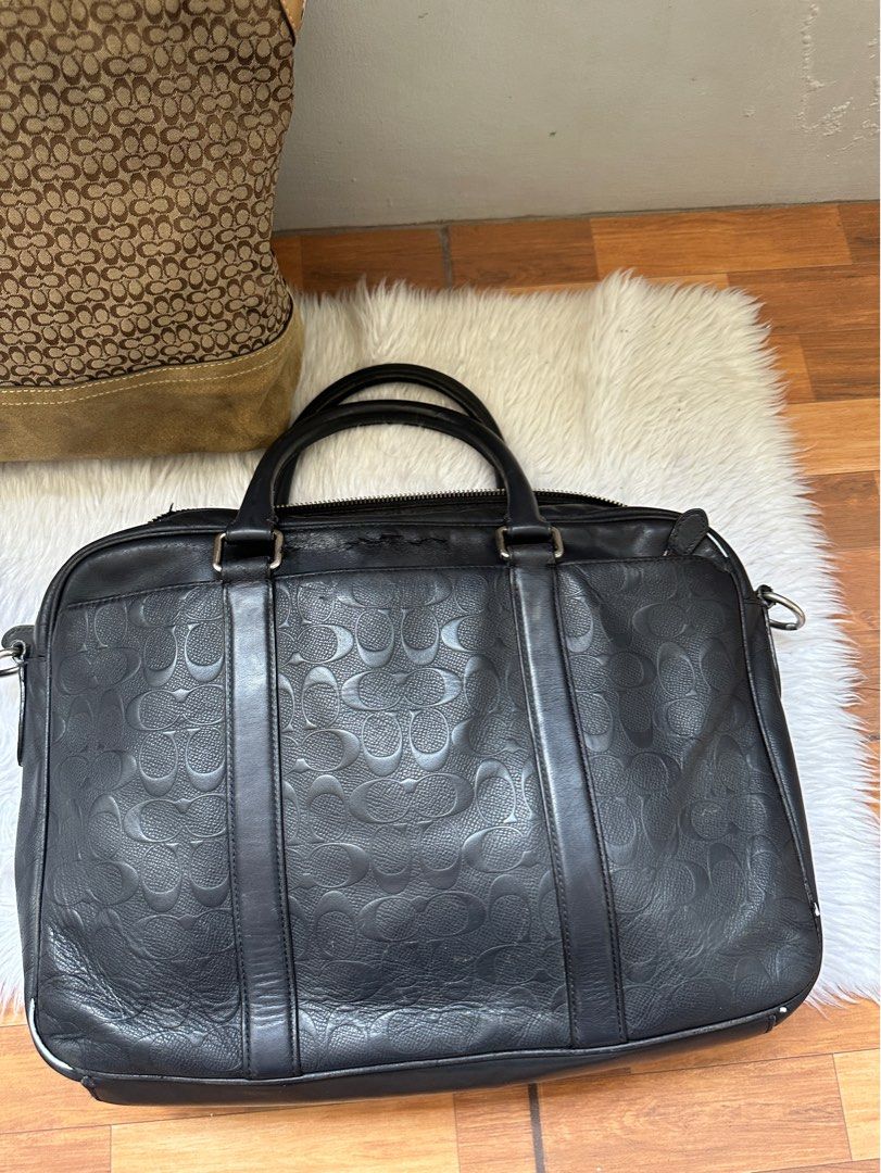Coach briefcase laptop bag original (Category: Luxury Bags & Wallets) located in Navotas City. Submitted by airakyunha84167 (Listing ID 1324976354, Image 2). Description: Coach laptop bag With creed Guaranteed original Sign of use sa isang side may gasgas po See pics for details Preloved po bawal sa maselan ✅zipper working .