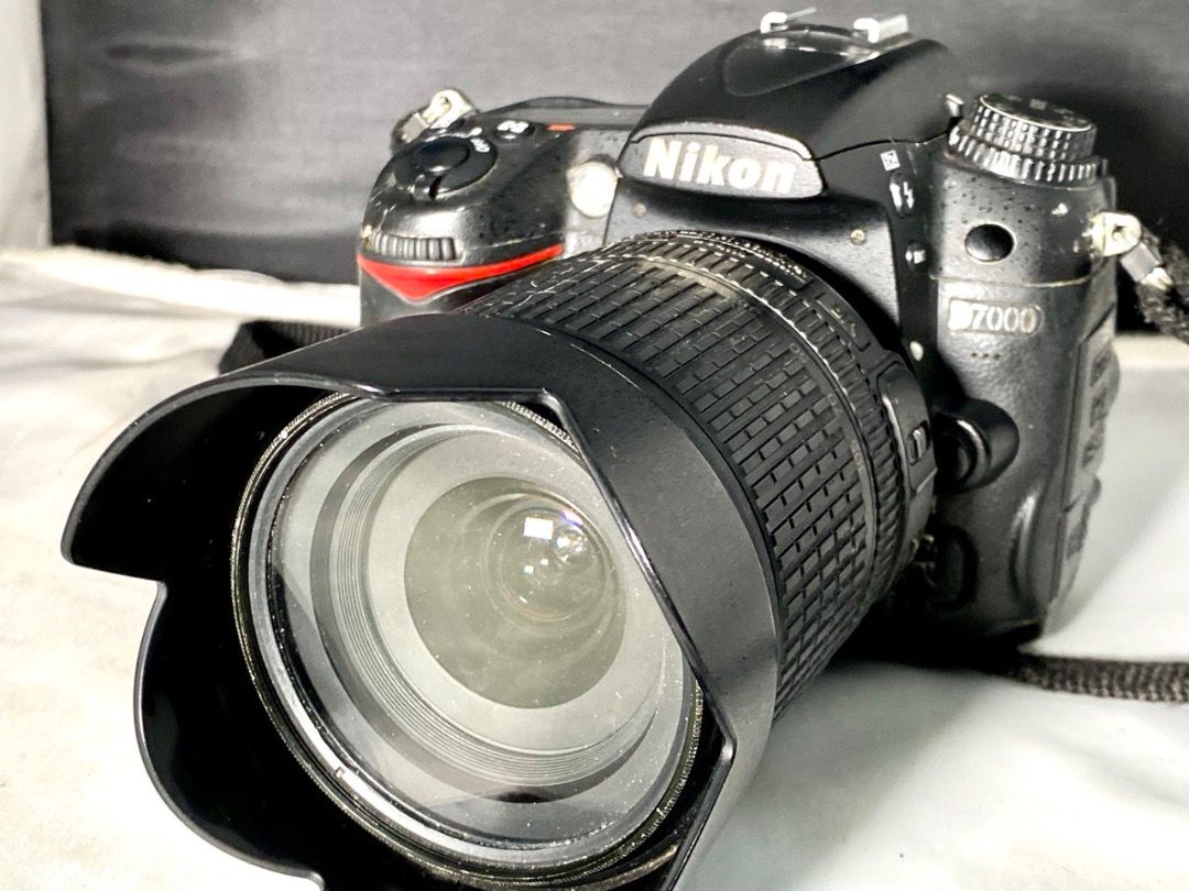 Rush. Full Package Nikon D7000 with 3 lenses slightly used (Category: Cameras) located in Manila. Submitted by bernardo1318 (Listing ID 1324948003, Image 3). Description: Nikon D 7000, shutter count 25K +-, Nikon Japan SB910 top of the line flash, Nikon Lenses: 55 mm prime lens, 18-105mm VR, 18-200mm, Phottix battery pack & 2 batteries, 1 Nikon battery, 8 rechargeable batteries, bag. .