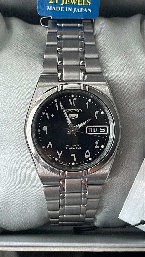 Rare Seiko 5 Arabic Dial (Category: Men's Watches) located in Quezon City. Submitted by secondhanditemsforsale (Listing ID 1324978748, Image 2). Description: Negotiable Complete set with manual user guide, guarantee card, and original box. Condition: New, all original parts-no aftermarket components. Features: Case Diameter: 34mm Case Thickness: 12mm Weight: 159 grams Water Resistance: 30M (3AM) / 100 feet Movement: Seiko Automatic Caliber 7S26 P