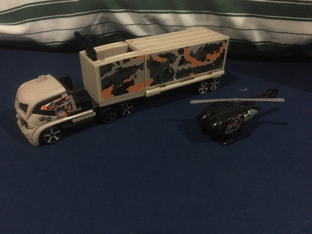 Hot Wheels Racing Rig - Helicopter Hauler (Category: Vehicle & Diecast Models) located in Paranaque City. Submitted by raon19 (Listing ID 1325255129, Image 1). Description: Complete Racing Rig Truck complete with the included Killer Copter/Skyfire. Minor Issue: Squeaking wheels due to age. Please manage your expectations. Payment via GCash or BPI. Meet-up within Merville Subdivision, Paranaque and satellite villages..