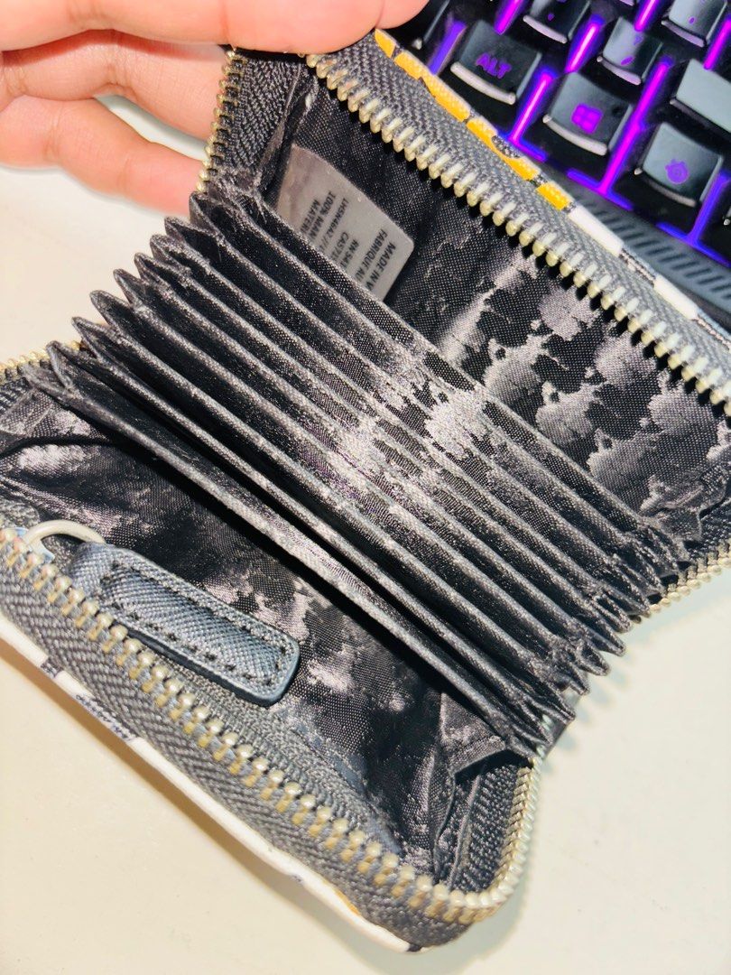 Karl Lagerfeld small wallet (Category: Wallets & Card holders) located in Bulacan. Submitted by tamiyaaa (Listing ID 1325242325, Image 2). Description: 11 card slots Faded color hardware (see photo 4) Bought for 3k Rfs: decluttering/too many wallets.