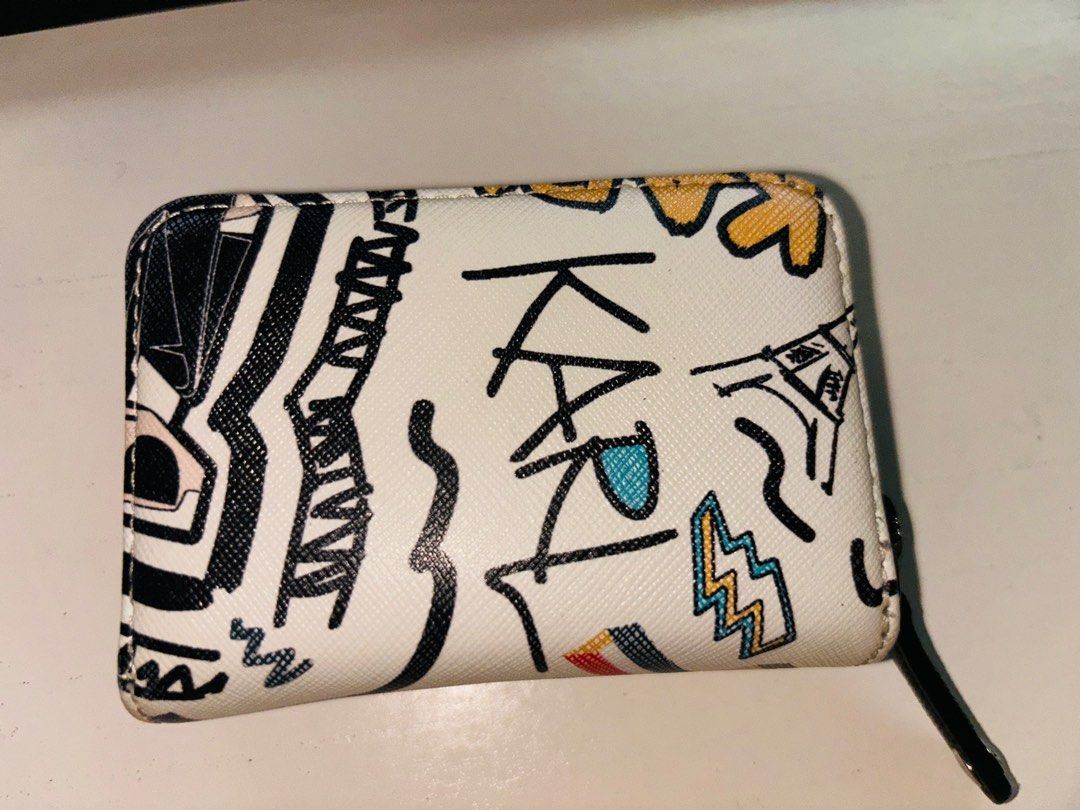 Karl Lagerfeld small wallet (Category: Wallets & Card holders) located in Bulacan. Submitted by tamiyaaa (Listing ID 1325242325, Image 3). Description: 11 card slots Faded color hardware (see photo 4) Bought for 3k Rfs: decluttering/too many wallets.