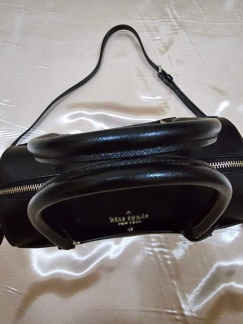 Kate Spade Medium Devyn Duffel Bag (Category: Luxury Bags & Wallets) located in Lumban. Submitted by xtnsale (Listing ID 1325332090, Image 3). Description: Mint condition. Like new. 6.7''h x 9.8''w x 5.1''d handle drop: 4" drop: 22" saffiano 2 way spade jacquard lining metal pinmount logo satchel with top zip closure interior front slip & back zip pockets exterior front & back slip pocket dust bag not included imported.