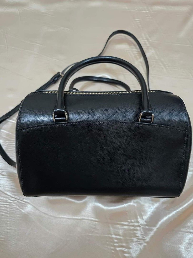 Kate Spade Medium Devyn Duffel Bag (Category: Luxury Bags & Wallets) located in Lumban. Submitted by xtnsale (Listing ID 1325332090, Image 2). Description: Mint condition. Like new. 6.7''h x 9.8''w x 5.1''d handle drop: 4" drop: 22" saffiano 2 way spade jacquard lining metal pinmount logo satchel with top zip closure interior front slip & back zip pockets exterior front & back slip pocket dust bag not included imported.