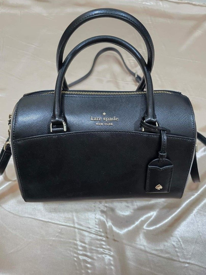 Kate Spade Medium Devyn Duffel Bag (Category: Luxury Bags & Wallets) located in Lumban. Submitted by xtnsale (Listing ID 1325332090, Image 1). Description: Mint condition. Like new. 6.7''h x 9.8''w x 5.1''d handle drop: 4" drop: 22" saffiano 2 way spade jacquard lining metal pinmount logo satchel with top zip closure interior front slip & back zip pockets exterior front & back slip pocket dust bag not included imported.