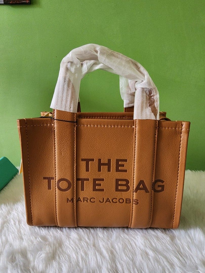 Marc Jacobs The Tote Bag (Category: Luxury Bags & Wallets) located in Rizal. Submitted by SassyCitiPH (Listing ID 1271157419, Image 1). Description: Marc Jacobs The Tote Bag Original with dustbag and tag 100% Original Money back guarantee if proven fake FB: Sassy Citi.