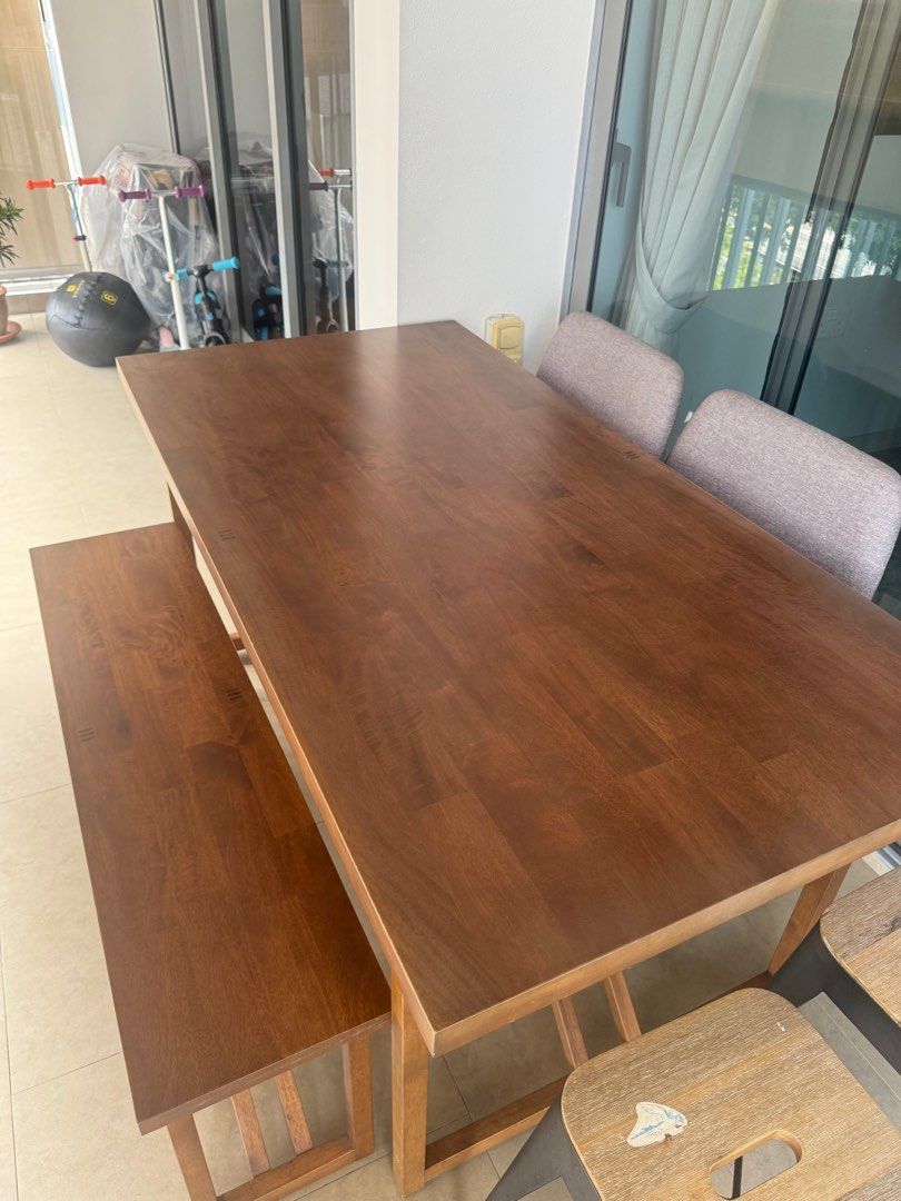 Solid Wood Dining Table (Category: Tables & Sets) located in Singapore. Submitted by ndeewong (Listing ID 1325320733, Image 1). Description: Looking to clear my balcony dining table. good condition. well maintained. solid quality wood. .