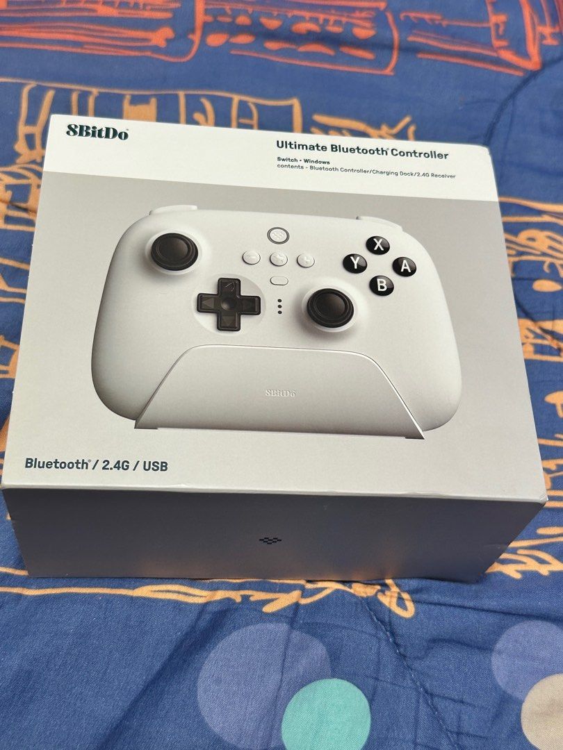8BitDo Ultimate Bluetooth Controller (Category: Controllers) located in Singapore. Submitted by ryang1809 (Listing ID 1325516488, Image 1). Description: 8BitDo Ultimate Bluetooth Controller for sale. Comes with charging dock and 2.4G Dongle receiver. Used only once. In pristine condition..