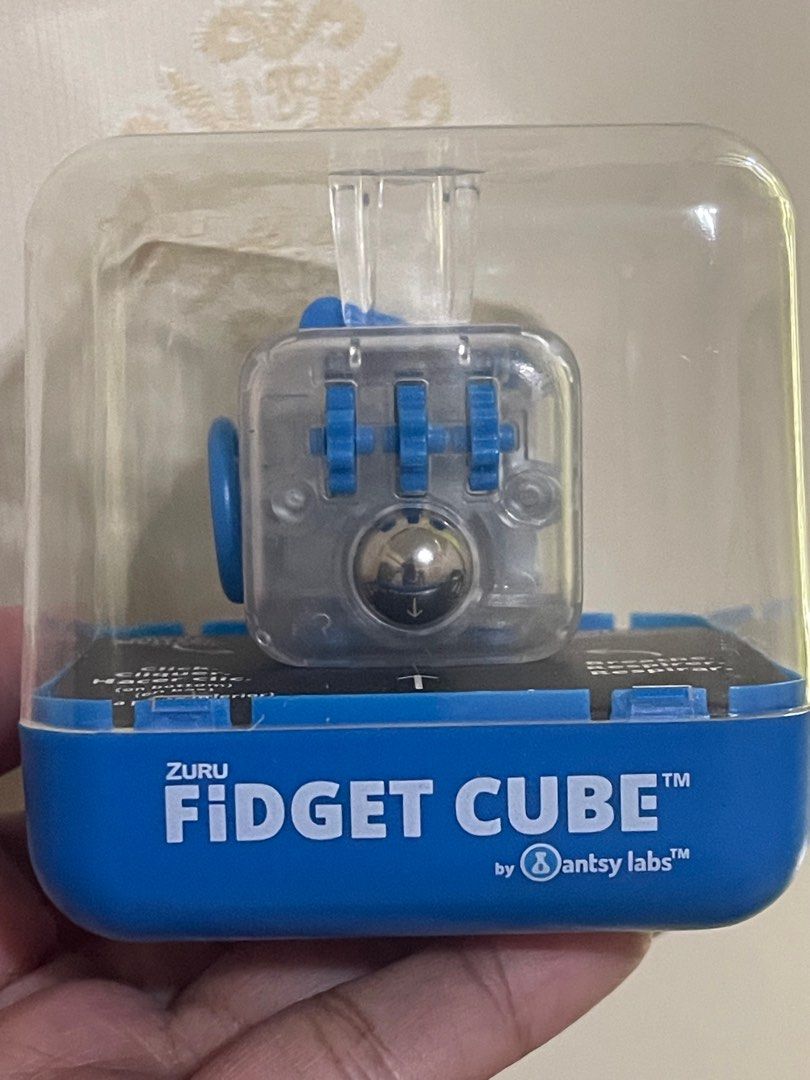 ANTSY LABS FIDGET CUBE ORIGINAL (Category: Designer & Blind Box Toys) located in Quezon City. Submitted by minion.craze (Listing ID 1325567897, Image 3). Description: ANTSY LABS USA FROM THE MAKERS OF THE ORIGINAL FIDGET CUBE 100% ORIGINAL TRANSPARENT w/ BLUE ALSO AVAILABLE: Glow in the dark Graphite Gray Midnight Black Teal LIMITED EDITION KICKSTARTER MIDNIGHT FRESH FOR ADULTS AND KIDS FREE THE FIDGET IN YOU SHIPPING VIA: LALAMOVE / GRAB LBC - C