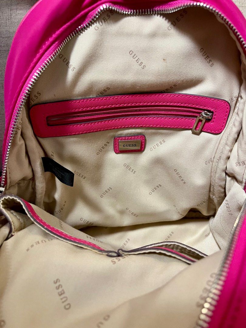 Guess backpack (Category: Luxury Bags & Wallets) located in Manila. Submitted by bebeella (Listing ID 1325472322, Image 3). Description: Selling this gorgeous Guess Little Bay Backpack in striking hot pink. It’s been used only once in Singapore and is in excellent condition, practically like new! The bag is perfect for everyday use, combining both style and functionality. Features include: • Durable nylon material • Adjustable straps for a custom