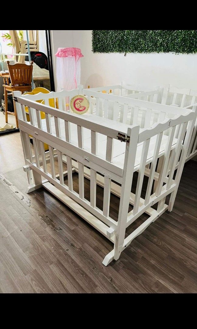 ROCKING BABY CRIB (Category: Cots & Cribs) located in Mandaluyong City. Submitted by graciazc (Listing ID 1325447653, Image 2). Description: ROCKING BABY CRIB Features: Foldable 2 layers adjustable up and down Dropside (Cosleeper) Detachable Rocker Hand Painted White Size: 23 x 36 Included: Bumper Guard RFS: Never nagamit. Co sleeper with baby since day 1. Walang actual picture dahil nakatabi na yung crib. But that's the actual itsura ng crib. Or