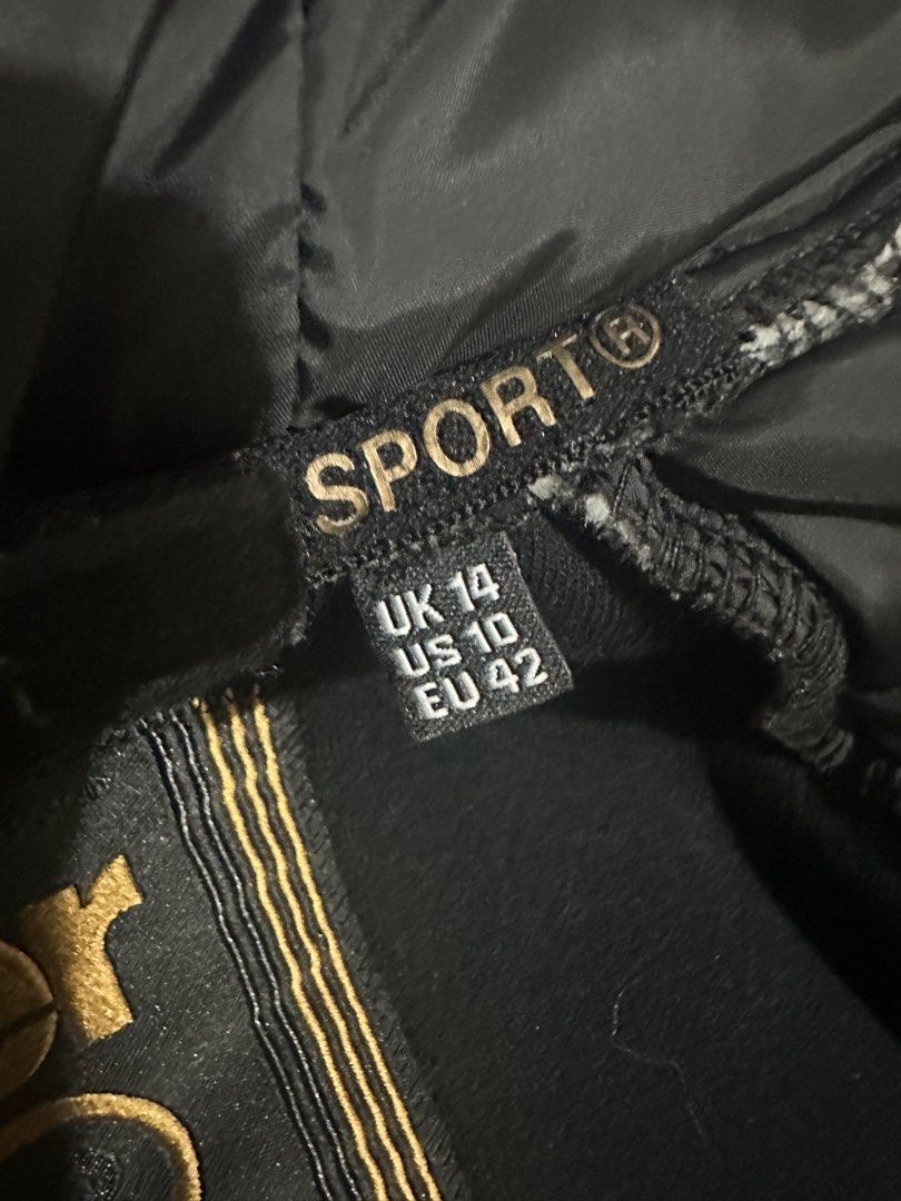 Superdry | Black & Gold Hoddie (Category: Coats, Jackets and Outerwear) located in San Fernando. Submitted by km_koleksyon (Listing ID 1325449683, Image 3). Description: Superdry | Sport Gold Black & Gold Hoddie Gmytech edition Lightly used Size on tag - uk14/us10/eu42 .
