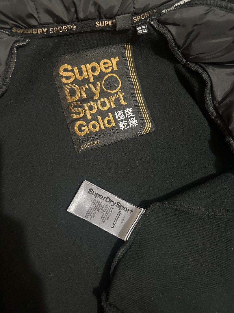 Superdry | Black & Gold Hoddie (Category: Coats, Jackets and Outerwear) located in San Fernando. Submitted by km_koleksyon (Listing ID 1325449683, Image 2). Description: Superdry | Sport Gold Black & Gold Hoddie Gmytech edition Lightly used Size on tag - uk14/us10/eu42 .