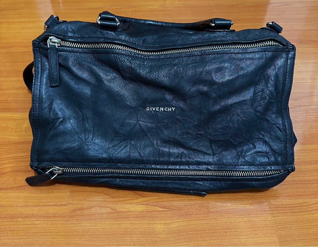Givency Bag (Category: Luxury Bags & Wallets) located in Makati City. Submitted by sheeca (Listing ID 1325647035, Image 1). Description: Givency bag Used and with some flaws. Selling it because I need to declutter and Im also not using it any longer..