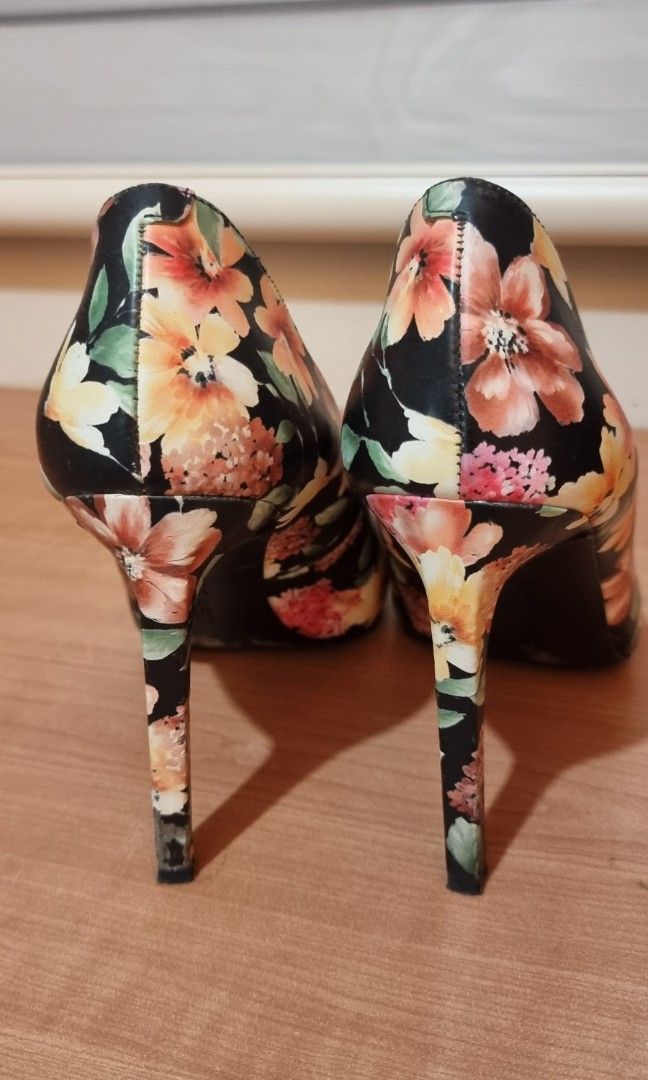 Nine West Floral heels (Category: Heels) located in Taguig. Submitted by closetraids (Listing ID 1325771113, Image 2). Description: Selling my Nine West floral print heels. These have been used less than 3x. Soles are still beautiful (as shown in photos). I included the cushions in the heels for comfort. Foot size is US 7.5. These shoes are at US 8 and they fit me just right. Heel height is 4 inches..