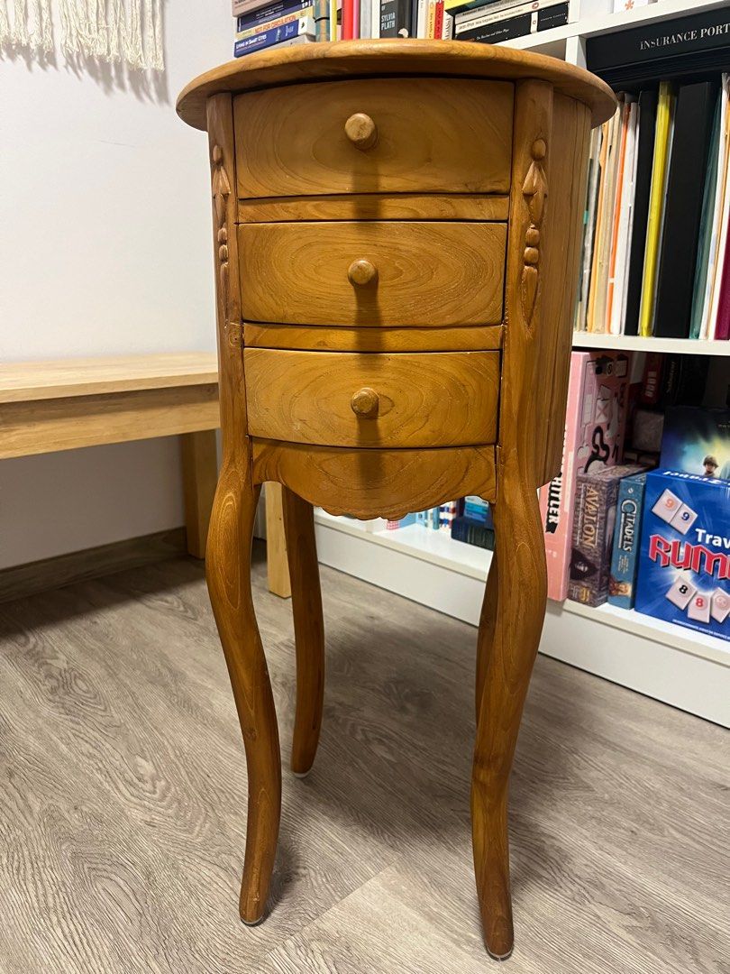 Solid Teak Side Table (Category: Other Home Furniture) located in Singapore. Submitted by shewaxedlyrical (Listing ID 1325753005, Image 1). Description: Solid teak side table in very good condition. Letting go for cheap because we’re moving. Self collection at Bedok North Road. Height 72cm Width 34cm.