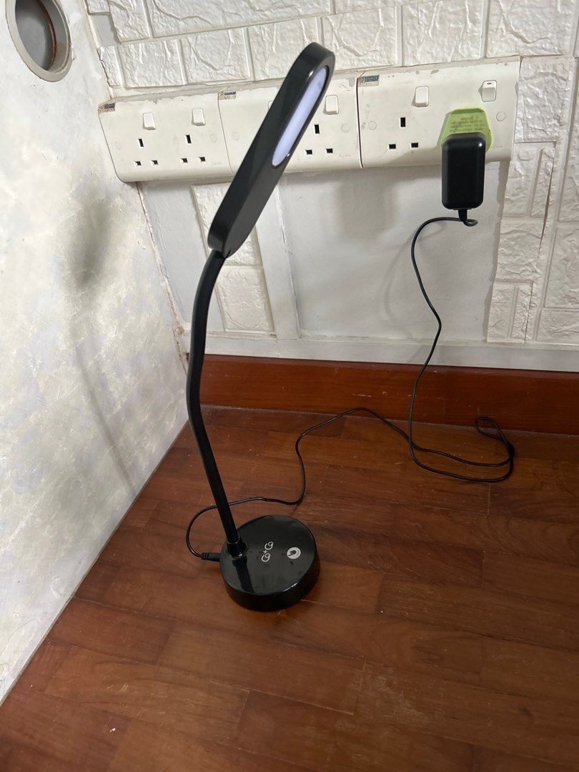 Table Lamp (Category: Lighting) located in Singapore. Submitted by MarcLee_99 (Listing ID 1325697821, Image 3). Description: Can change four diffrent brightness and able to adjust the neck of the lamp .