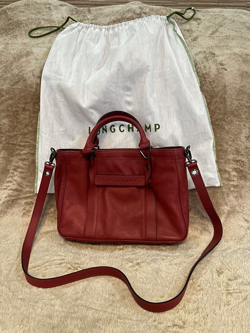 Longchamp 3D Handbag with removable strap (Category: Luxury Bags & Wallets) located in Lipa City. Submitted by 2013124841 (Listing ID 1325896680, Image 1). Description: Longchamp 3D Handbag S Magenta (with removable strap) Longchamp style number: 10197HCV299 Hand bag / Crossbody bag Material: Calfskin Leather Lining: Recycled polyamide and polyester - Jacquard, Longchamp horses Retails ₱57,000 at Rustan’s Used less than 5x ⚠️ Check the 4th photo 