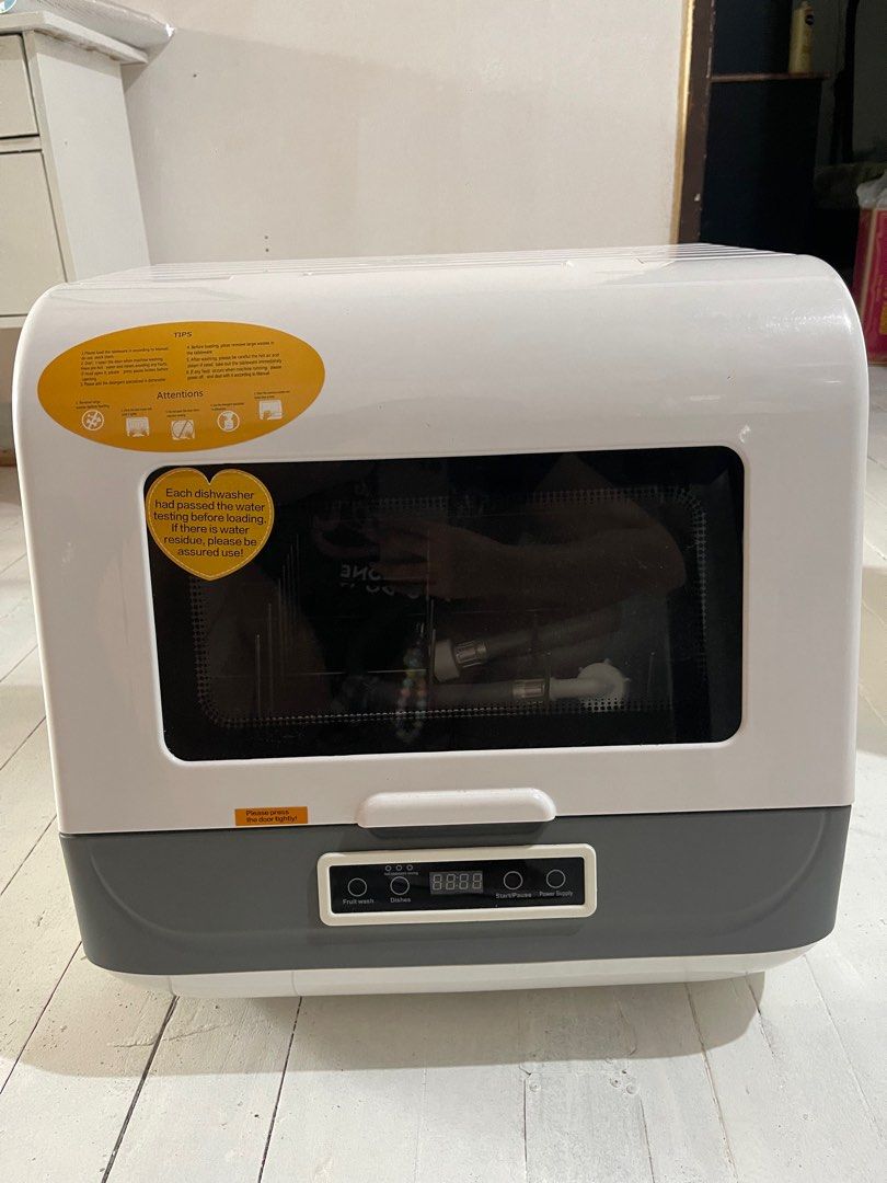 Mini Dishwasher (Category: Dishwasher) located in Manila. Submitted by vieecisco (Listing ID 1325812043, Image 1). Description: -Almost Brand New -Bought from Purple App last 2021 but never opened until this year to test -Opened only for testing -Works Well and Cleans Dishes -Hose Included -Dish Rack Included Can do meetup around Olongapo City, Zambales.