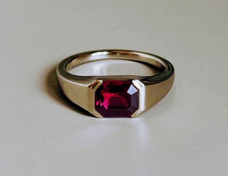 Custom Made-Men's Ruby Ring (Category: Rings) located in Singapore. Submitted by miyajewelry (Listing ID 1325990848, Image 1). Description: https://cherrygems.sg/products/glamorous-ruby-ring This stunning ring features a vibrant yellow sapphire set in a gold band, perfect for adding a touch of elegance and sophistication to any outfit. The yellow sapphire, known for its bright and cheerful hue, symbolizes wisdom, prosperity, and joy. The simple y