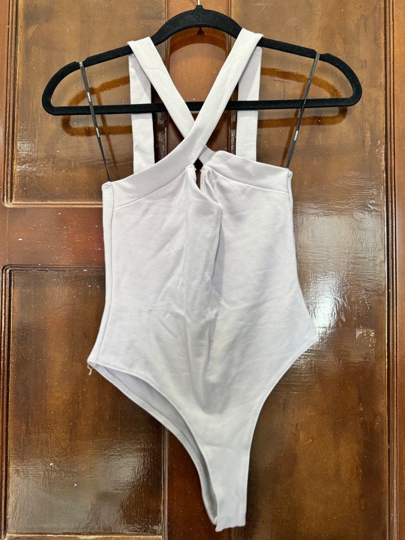 Forever21 crisscross tank bodysuit (Category: Others Tops) located in Pagadian. Submitted by kcmph (Listing ID 1326144177, Image 2). Description: Forever21 crisscross tank bodysuit Size small Euc bought bn Plus sf.
