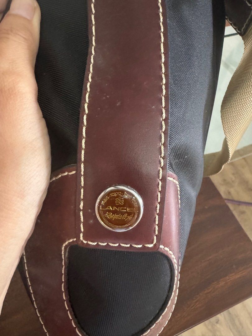 Lancel Shoulder Bag (Category: Luxury Bags & Wallets) located in Tagaytay City. Submitted by prelovedbytmj (Listing ID 1326019754, Image 3). Description: Lancel Shoulder Bag . Black in color combination of brown. Medium size. Good condition. .