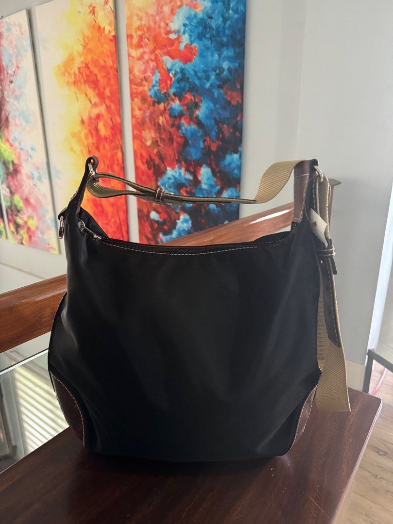 Lancel Shoulder Bag (Category: Luxury Bags & Wallets) located in Tagaytay City. Submitted by prelovedbytmj (Listing ID 1326019754, Image 1). Description: Lancel Shoulder Bag . Black in color combination of brown. Medium size. Good condition. .