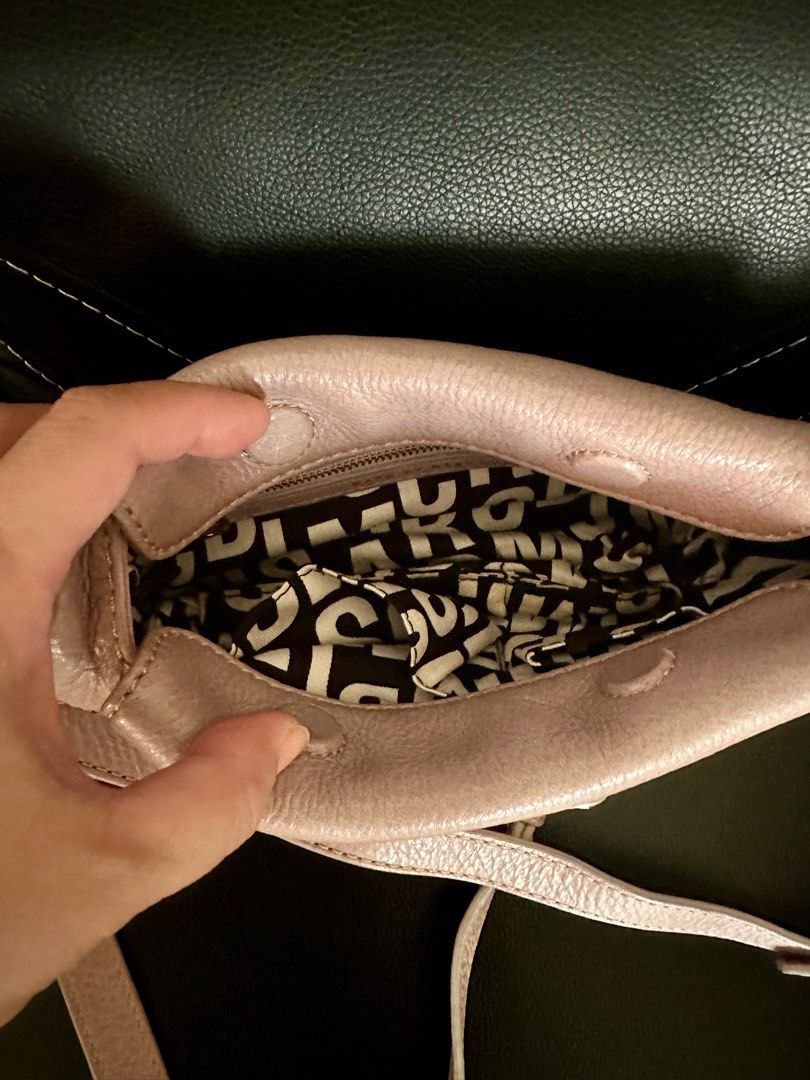 Marc Jacobs - Authentic 💯❗️ (Category: Cross-body Bags) located in Marikina City. Submitted by rizza_35 (Listing ID 1326077666, Image 3). Description: Brand : MARC JACOBS item description : sling bag with magentic lock Color : medium beige Size : small but can fit two big phone with small wallet Condition : like new though has sign of use - considered rank A .