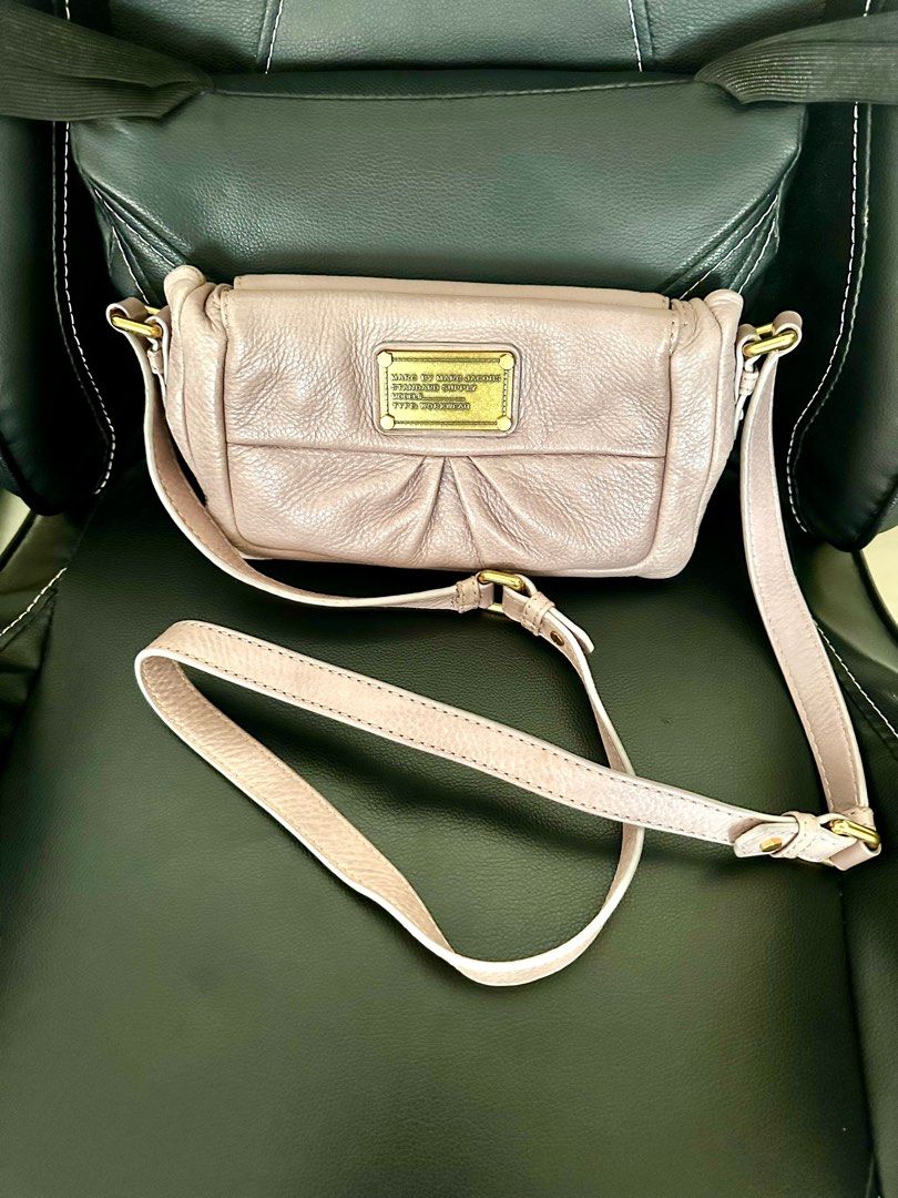 Marc Jacobs - Authentic 💯❗️ (Category: Cross-body Bags) located in Marikina City. Submitted by rizza_35 (Listing ID 1326077666, Image 1). Description: Brand : MARC JACOBS item description : sling bag with magentic lock Color : medium beige Size : small but can fit two big phone with small wallet Condition : like new though has sign of use - considered rank A .