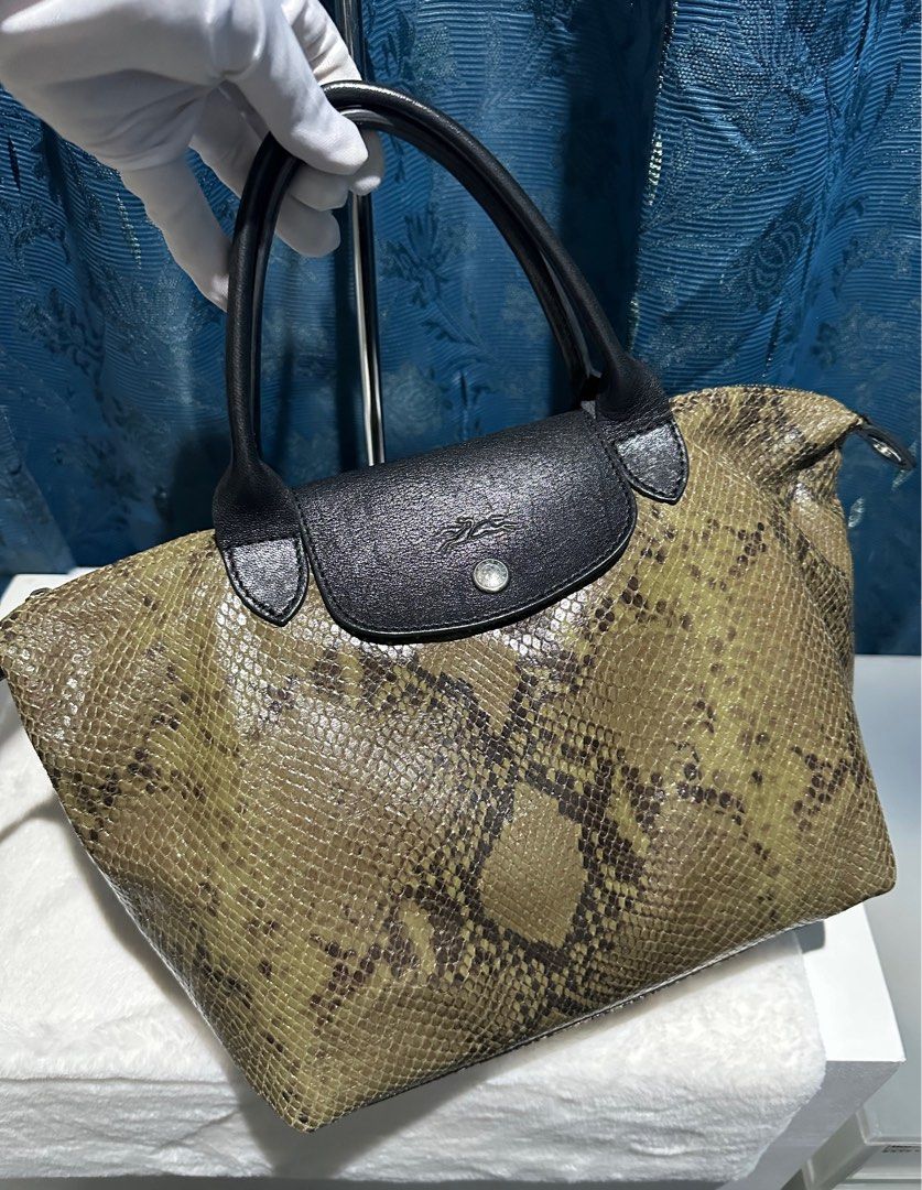 New Authentic Longchamp Neo Python Small Limited Edition Two way Bag (Category: Luxury Bags & Wallets) located in Pasig City. Submitted by bestluxurybuys (Listing ID 1326075829, Image 3). Description: New condition Authentic Longchamp Neo Python Small Limited Edition Two way Bag Dm or Vber O92755II747.