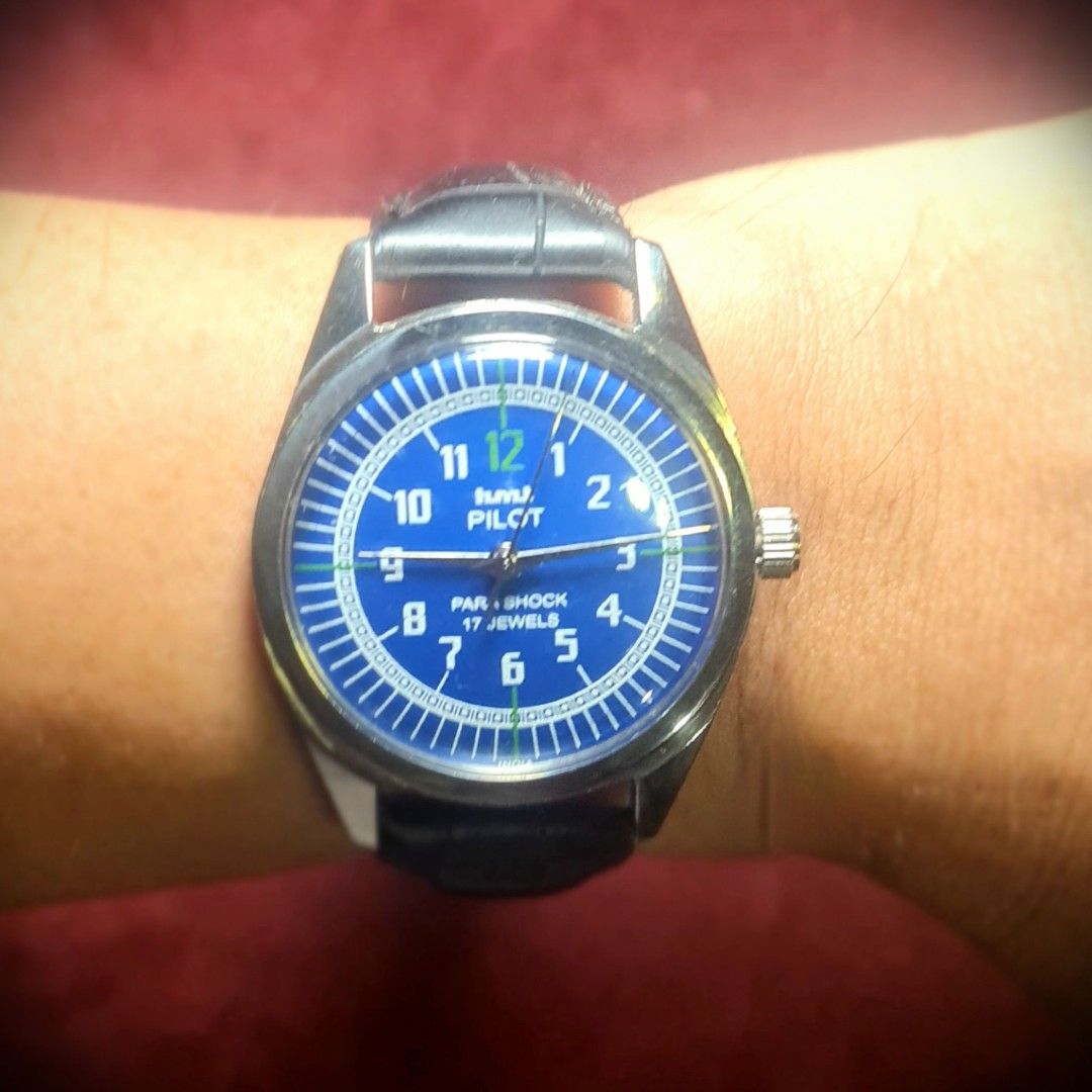 #Vintage Watch #Mechanical #HMT Pilot #Navy Blue (Category: Men's Watches) located in Caloocan City. Submitted by allig8 (Listing ID 1326142261, Image 2). Description: This vintage HMT Pilot watch boasts a stunning silvery case with a beautiful round Bronze dial that features numerical hour markers as indices. The 36mm case houses a reliable mechanical shock-proof movement, ensuring accurate timekeeping that will last beyond a lifetime. The two-p
