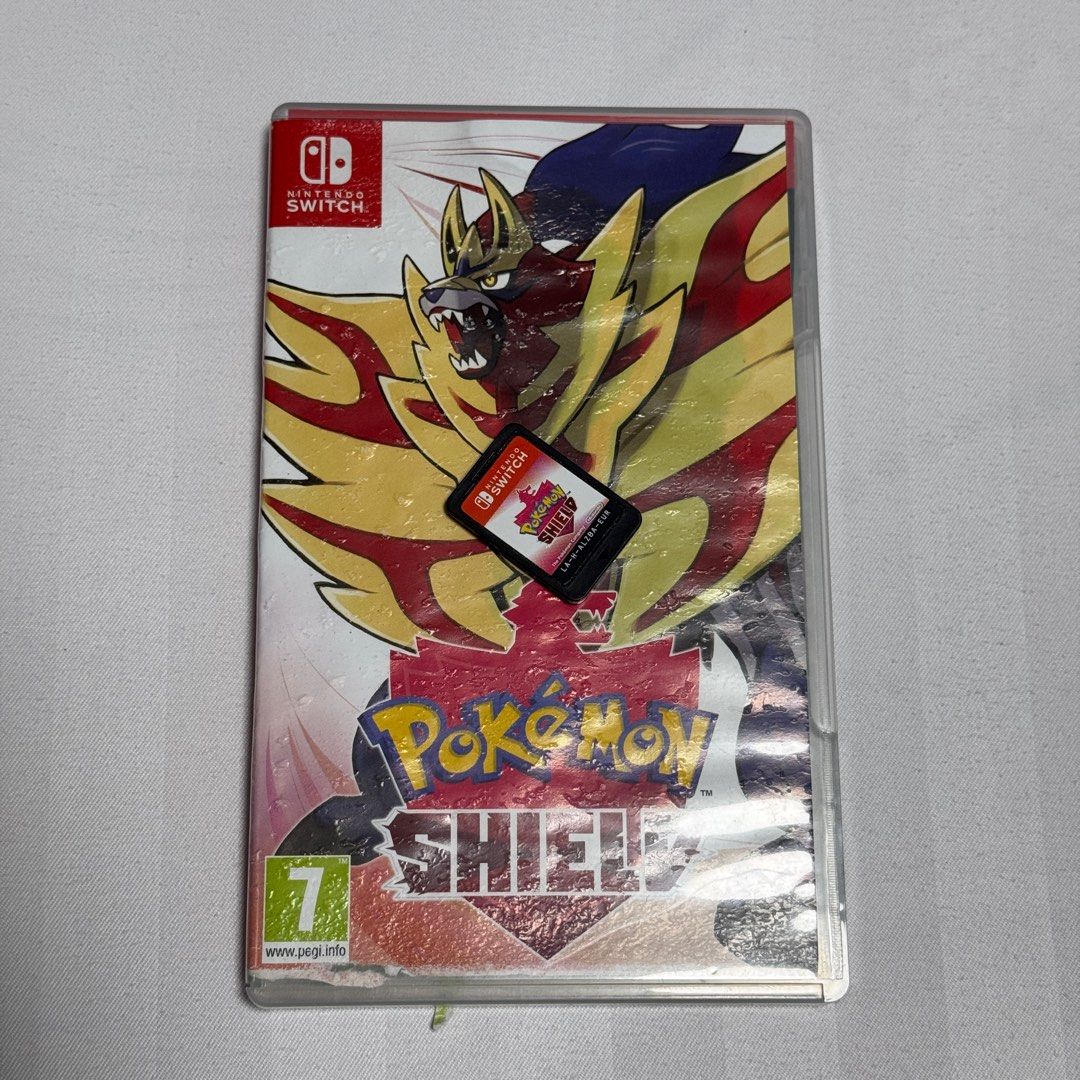 Nintendo Switch Pokemon Shield (Damaged Cover) (Category: Nintendo) located in Antipolo. Submitted by iwitchking (Listing ID 1326261951, Image 1). Description: Cartridge is pristine but case has water damaged cover. .