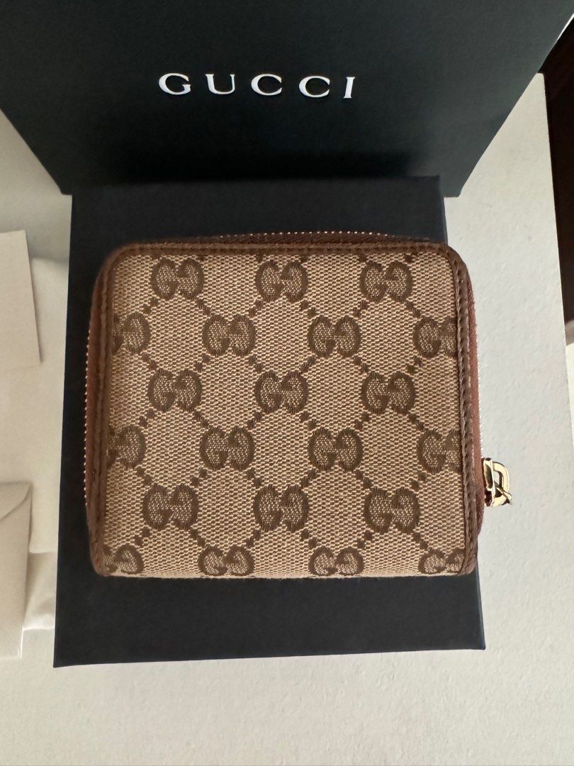 GUCCI Bree Canvas Brown Bifold Wallet (Category: Luxury Bags & Wallets) located in San Fernando. Submitted by ms.mlsluxeboutique (Listing ID 1326351620, Image 3). Description: •100% authentic or moneyback guarantee if proven fake •Purchased from theglamzone.ph_luxe on IG (100% legit luxury online seller) •Purchased price: P20k •Complete inclusions (paperbag, dustbag, cards) •8/10 conditions •Issue: Rubs on side and corner of the wallet and minor 