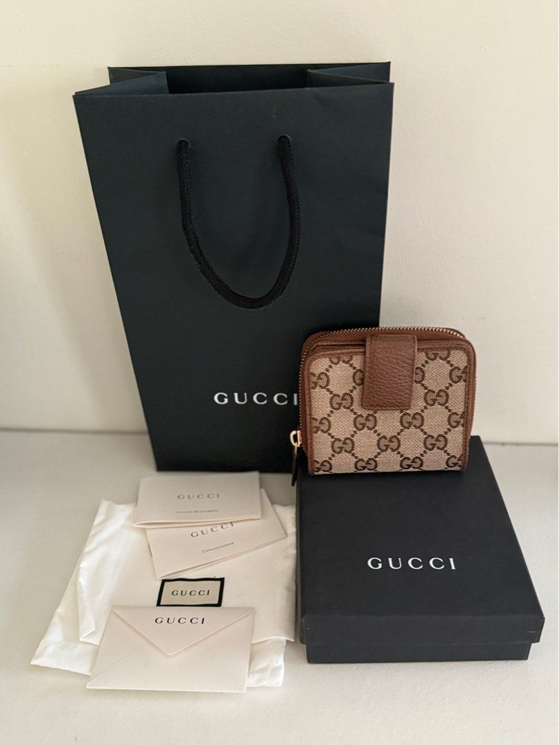 GUCCI Bree Canvas Brown Bifold Wallet (Category: Luxury Bags & Wallets) located in San Fernando. Submitted by ms.mlsluxeboutique (Listing ID 1326351620, Image 1). Description: •100% authentic or moneyback guarantee if proven fake •Purchased from theglamzone.ph_luxe on IG (100% legit luxury online seller) •Purchased price: P20k •Complete inclusions (paperbag, dustbag, cards) •8/10 conditions •Issue: Rubs on side and corner of the wallet and minor 