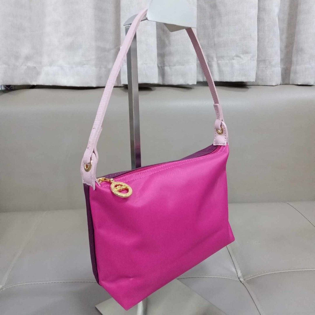 Longchamp Pochette Multi Color (Category: Luxury Bags & Wallets) located in Taguig. Submitted by esa.agustin (Listing ID 1326360096, Image 2). Description: Original Longchamp nylon multi color pochette type bag. With care card. Hologram inside..