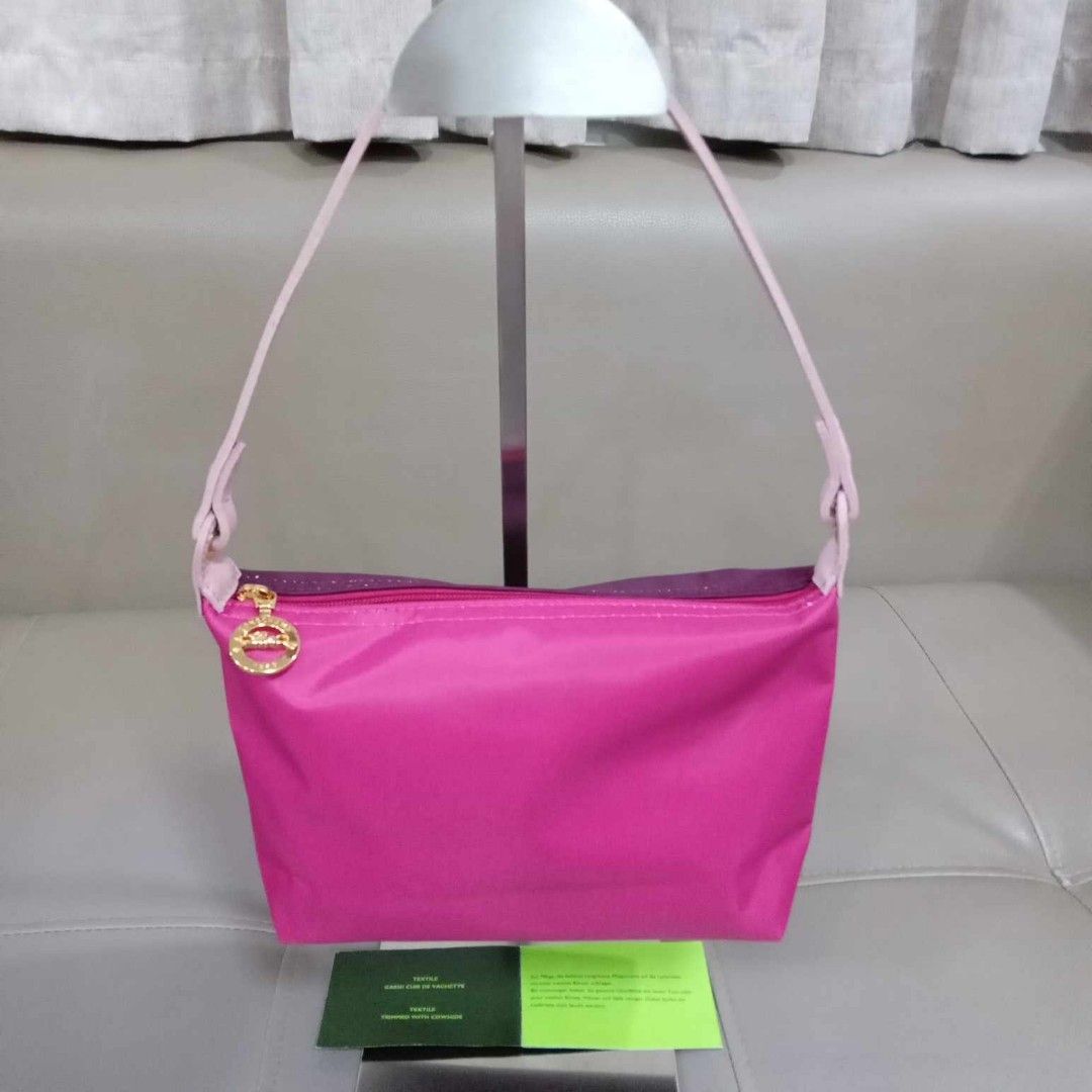 Longchamp Pochette Multi Color (Category: Luxury Bags & Wallets) located in Taguig. Submitted by esa.agustin (Listing ID 1326360096, Image 1). Description: Original Longchamp nylon multi color pochette type bag. With care card. Hologram inside..