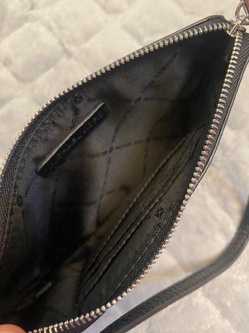 MK Black Wristlet (fits iphone plus phone) (Category: Wallets & Card holders) located in Marikina City. Submitted by neltan_carousel (Listing ID 1326354888, Image 3). Description: 💯% Authentic/Original MK Wristlet • brand new • Inclusions: Care card and price tag only.