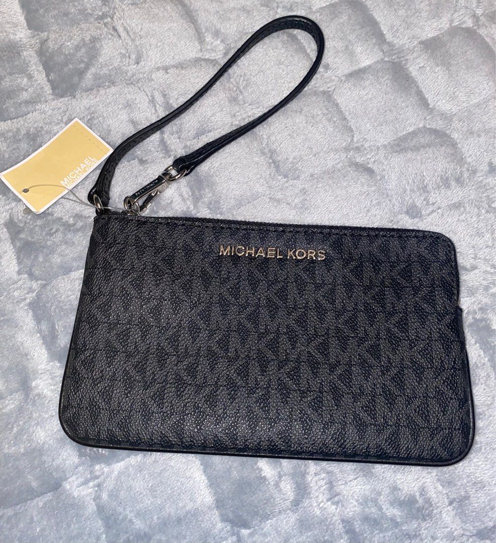 MK Black Wristlet (fits iphone plus phone) (Category: Wallets & Card holders) located in Marikina City. Submitted by neltan_carousel (Listing ID 1326354888, Image 1). Description: 💯% Authentic/Original MK Wristlet • brand new • Inclusions: Care card and price tag only.
