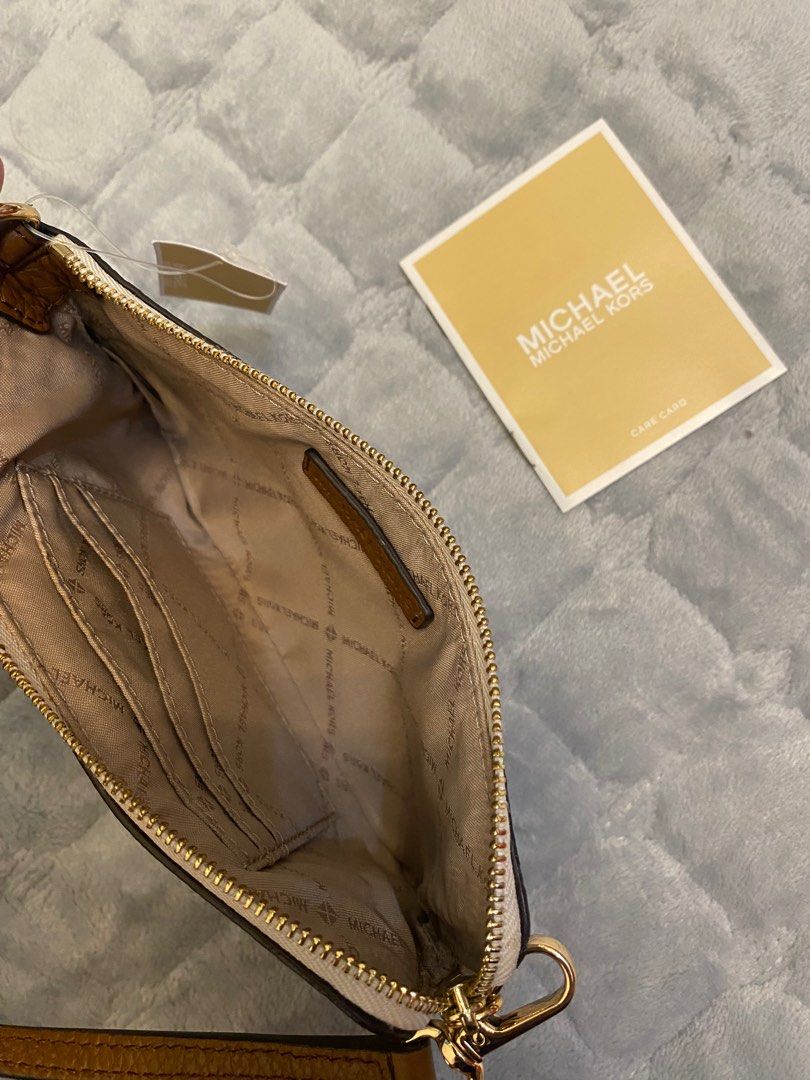 MK Wristlet (fits iphone plus phones) (Category: Luxury Bags & Wallets) located in Marikina City. Submitted by neltan_carousel (Listing ID 1326351199, Image 3). Description: 💯% Authentic/Original MK Wristlet • fits iphone plus phones • inclusions: care card & price tag only.