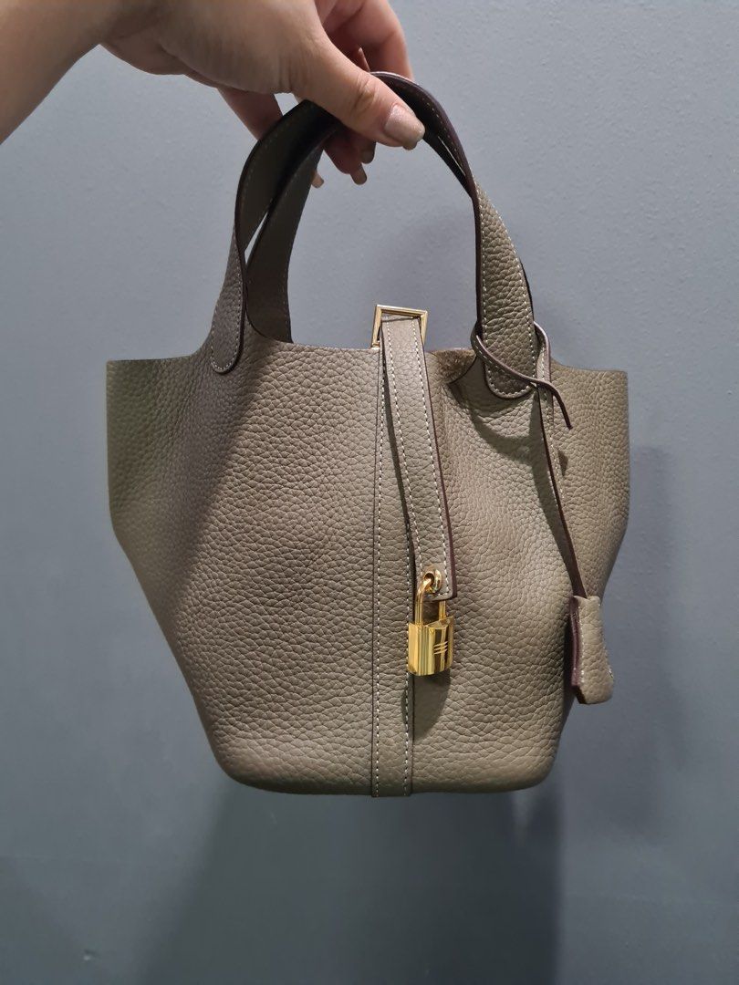 Picotin 18 in Etain (Category: Luxury Bags & Wallets) located in Quezon City. Submitted by lesgosago (Listing ID 1326446820, Image 1). Description: NGA but coded Soft genuine leather Bought from another online seller Bag, lock and key only, as is. MOP: gcash/BPI MOD: sdd/lbc.