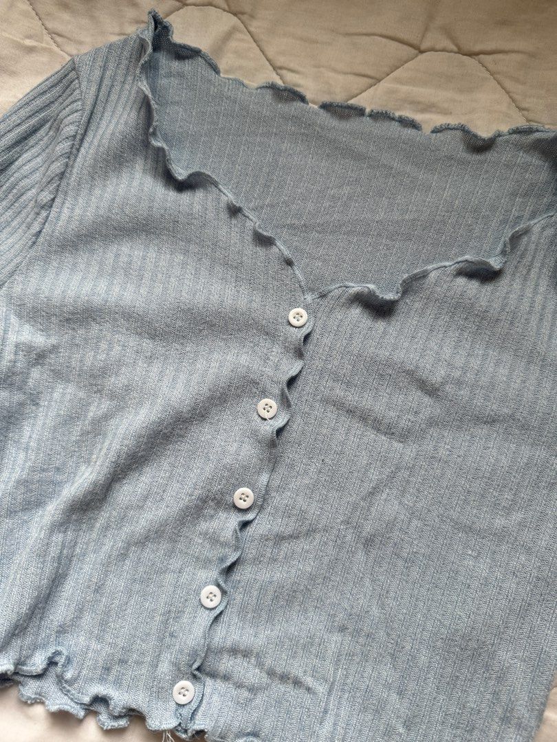 Baby Blue Cropped Cardigan (Category: Longsleeves) located in Imus. Submitted by keyluhhh (Listing ID 1323322415, Image 2). Description: Bought in the States Slightly above the belly button, cute fit! Rfs: not my style anymore MOP: gcash/maya/BPI MOD: gogoxpress/lalamove/grab/angkas Helping tags: shein, zara, cider, forever 21, h&m, hm, bershka, uniqlo, GU, don quijote, pacsun, bench, penshoppe, kamiseta, kashieca, plains and prints, bayo, human,