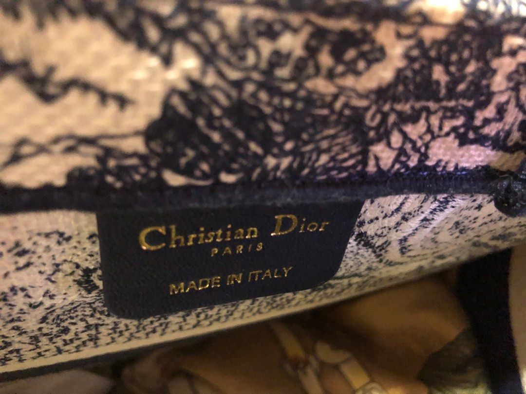 Dior book tote (Category: Bags & Wallets) located in Singapore. Submitted by vcsh898921487 (Listing ID 1323388092, Image 3). Description: No stain and used a few times lightly .