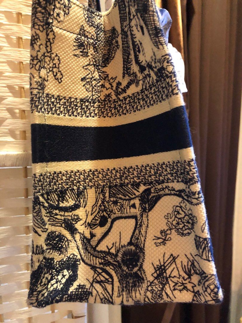 Dior book tote (Category: Bags & Wallets) located in Singapore. Submitted by vcsh898921487 (Listing ID 1323388092, Image 2). Description: No stain and used a few times lightly .