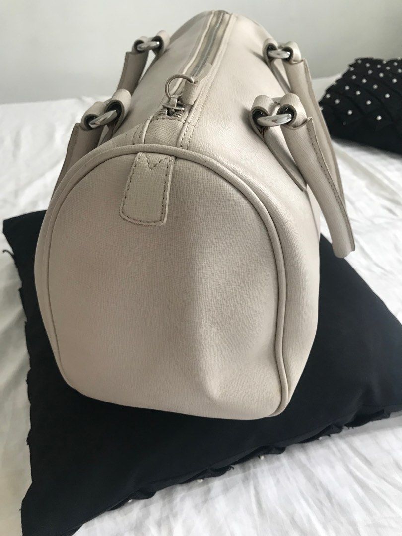 Furla Cream Leather Hand Bag (Category: Luxury Bags & Wallets) located in Makati City. Submitted by laineycops (Listing ID 1323346098, Image 3). Description: min flaw: min wear on the bottom edges, lip stick stain inside sold as is 3 compartments silver hardware genuine leather rfs: fam declutter ***see about on profile.