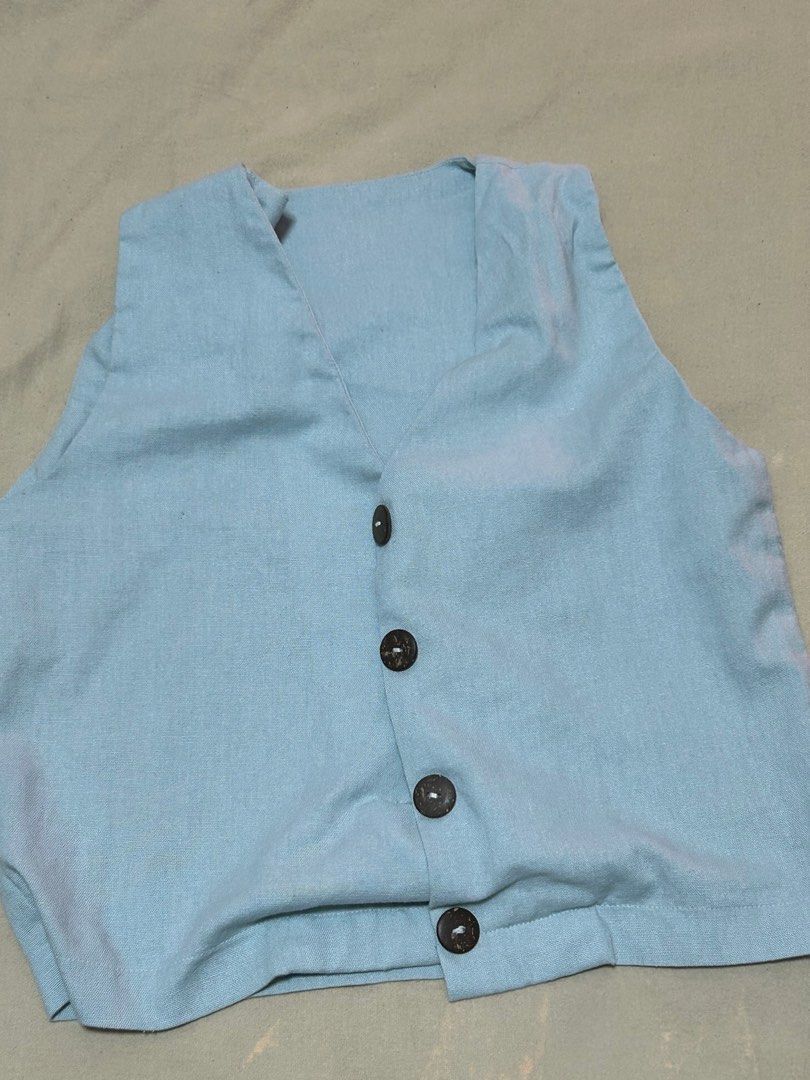 Maxi Linen Vest Light Blue (Category: Sleeveless) located in Quezon City. Submitted by kn.declutters (Listing ID 1323443469, Image 2). Description: Good as new Stitched the buttons to reinforce yung kapit No when worn photo, kindly browse their IG page na lang :).