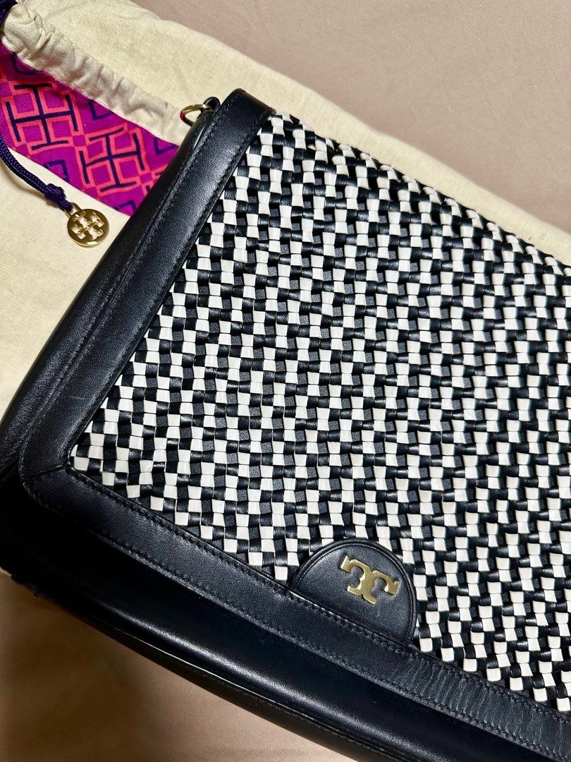 Preloved Tory Burch Woven Leather Bag (Category: Luxury Bags & Wallets) located in Manila. Submitted by kathsy_16 (Listing ID 1323415732, Image 3). Description: Bought for: Php 25,000 With dustbag, slightly used Length: 12 inches Height: 9 inches.