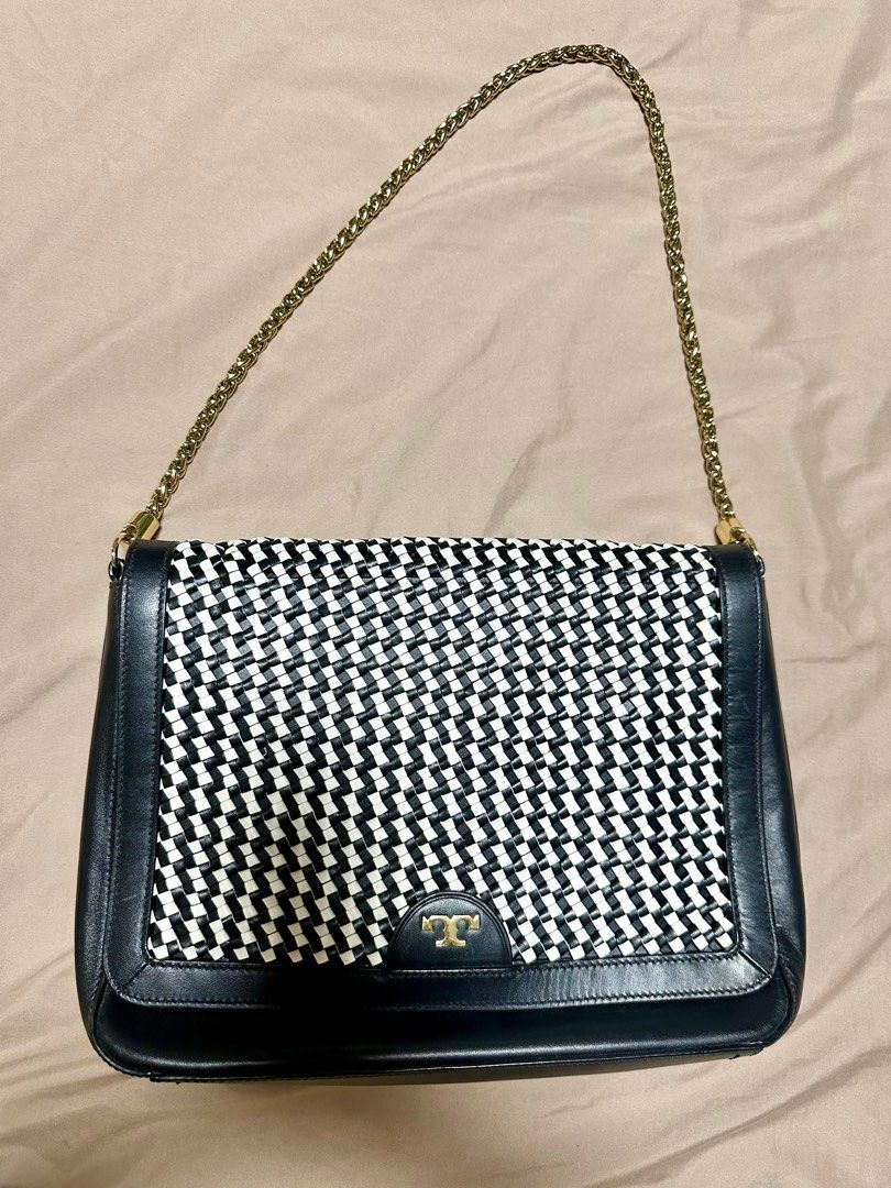 Preloved Tory Burch Woven Leather Bag (Category: Luxury Bags & Wallets) located in Manila. Submitted by kathsy_16 (Listing ID 1323415732, Image 1). Description: Bought for: Php 25,000 With dustbag, slightly used Length: 12 inches Height: 9 inches.