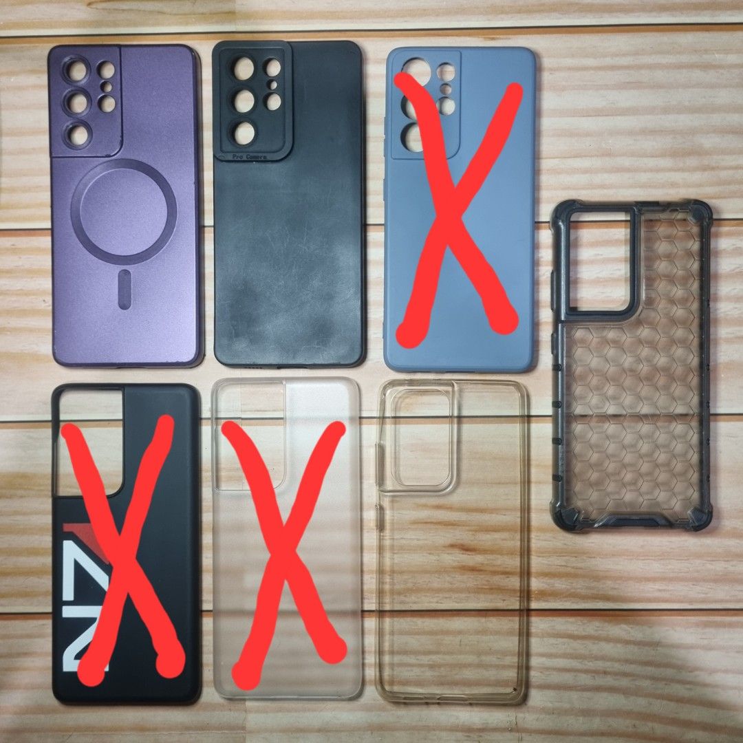 Samsu g S21 Ultra cases (Category: Cases & Sleeves) located in Pasig City. Submitted by bananajellybean (Listing ID 1314309902, Image 1). Description: 100 each top right to bottom left: purple magnetic case (rarely used) black matte silicone case gray matte silicone case black hard case with N7 sticker clear matte hard case (rarely used) clear silicone case shockproof honeycomb case (far left).